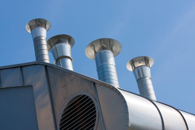 Technician conducting fume hood airflow testing