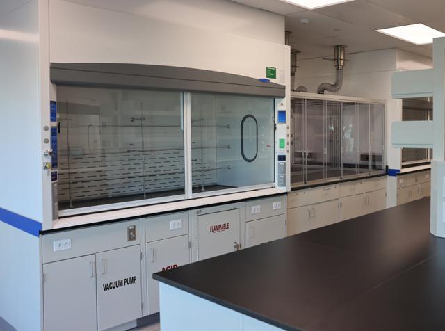 Laboratory fume hood with proper ventilation and safety equipment